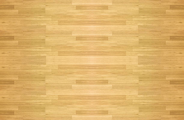 istock Maple hardwood basketball floor pattern as viewed from above. 496402706