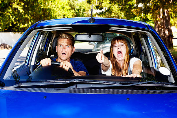 istock Watch out! Panicking couple try to avoid car accident 496402825