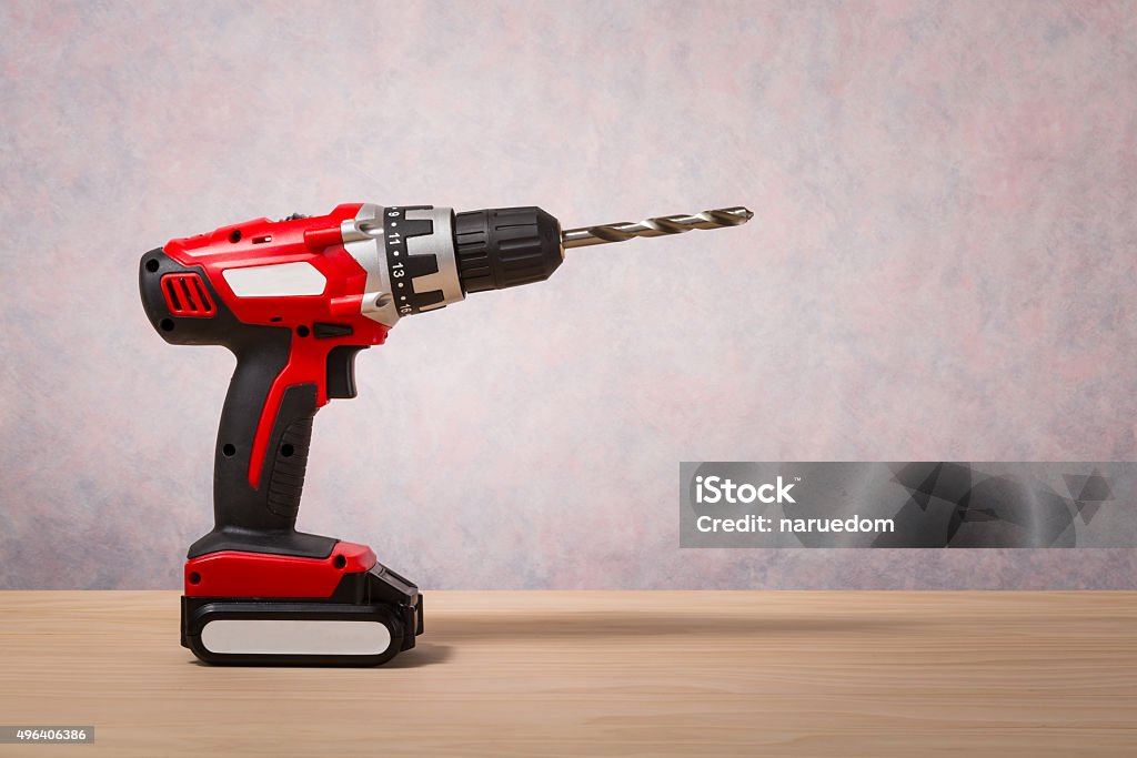 Screwdriver, Cordless Drill Screwdriver, Cordless Drill on wood table Drill Stock Photo