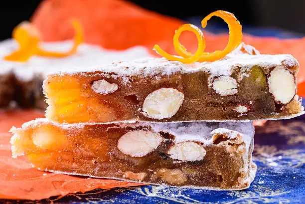 Panforte fruitcake with fruits, nuts and spices.Traditional italian christmas cake typical cake of Siena.
