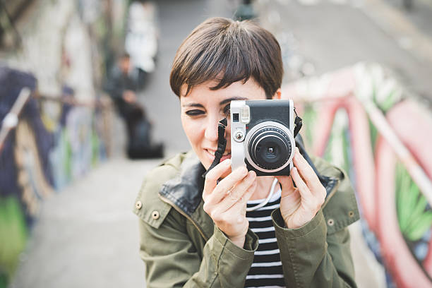 istock Young handsome woman taking photos 496409904