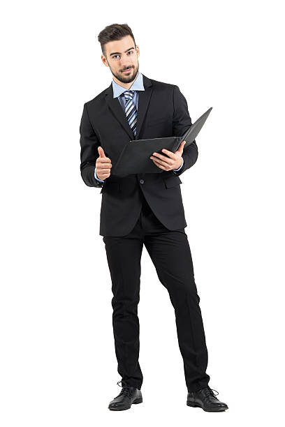 istock Young confident business man holding document folder with thumb up 496413524