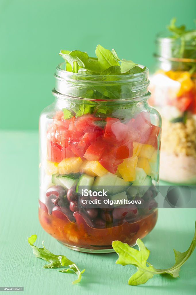 vegan quinoa bean vegetable salad in mason jars 2015 Stock Photo