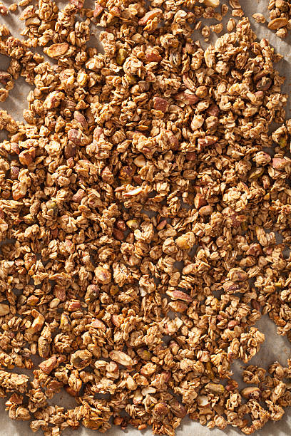 istock homemade healthy granola on backing paper background 496414538