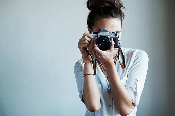Photography- the beauty of life captured Cropped shot of a young woman taking a photo with a vintage camerahttp://195.154.178.81/DATA/i_collage/pu/shoots/805862.jpg vintage camera stock pictures, royalty-free photos & images