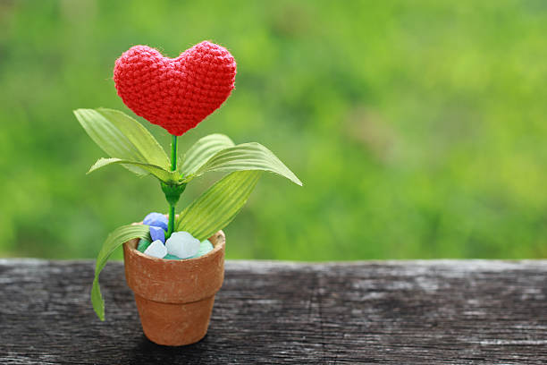 istock Valentines Day background with crochet heart on old wood. 496416644