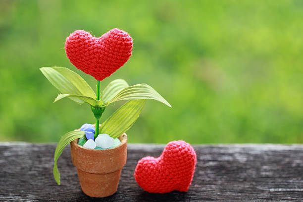 istock Valentines Day background with crochet heart on green background. 496416824