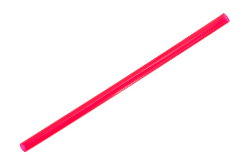 A jumbo sized red drinking straw for smoothies and milkshakes isolated on a white background.