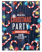 istock Party Invitation On Wood With Christmas Lights and Candy canes 496430324