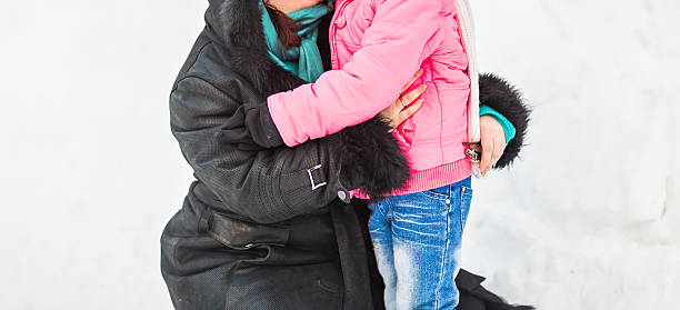 istock mother with her daughter in winter park 496432270