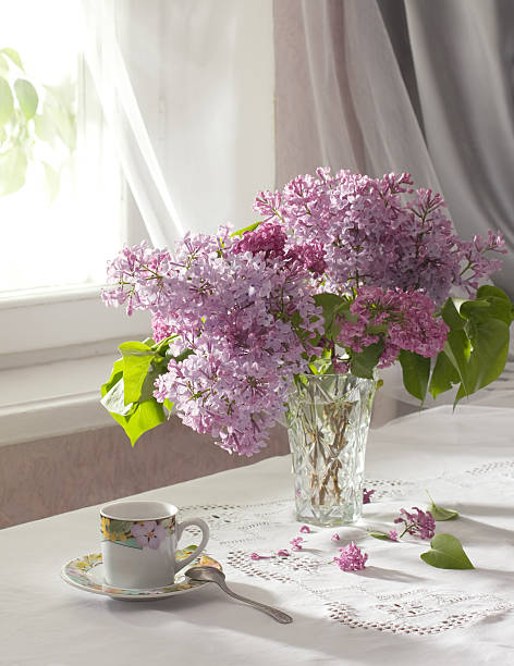 istock Retro still life with a bouquet of lilac. 496432988