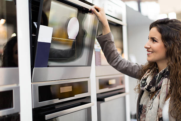 istock Woman choosing stove 496433454
