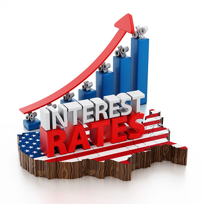 Interest rates text on USA map textured with American flag and bar graph with rising arrow isolated on white.