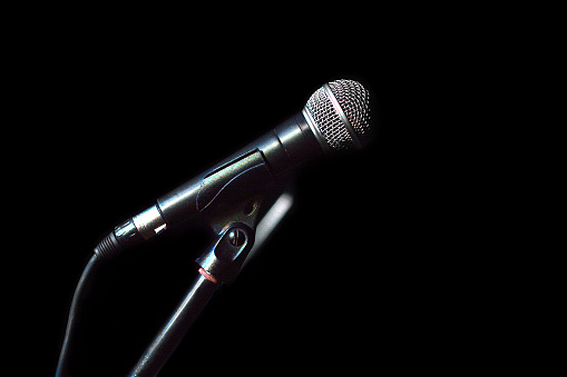 Microphone isolated on black background side view closeup