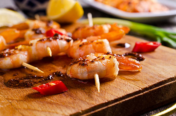 istock Cooked shrimp on skewers 496435434