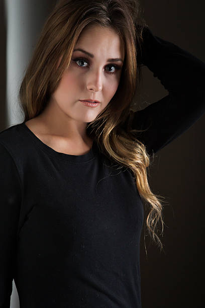 istock Beautiful young fashion model posing in black top 496436830
