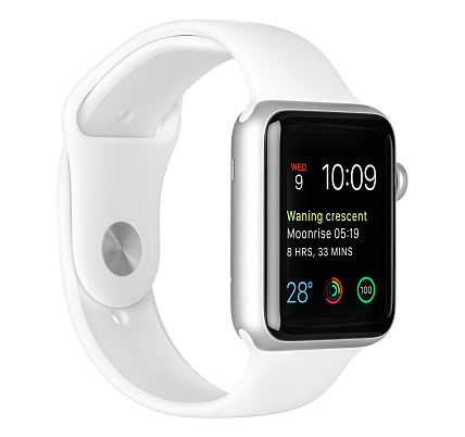 Varna, Bulgaria - October 16, 2015: Apple Watch Sport 42mm Silver Aluminum Case with White Sport Band with modular clock face on the display. Left side view fully in focus. Isolated on white background.