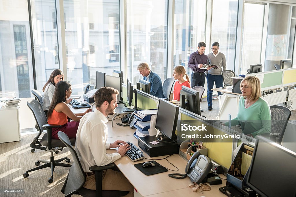Best Computer For Office Work Office Workers At Desks Using Computers In Modern Office Stock Photo