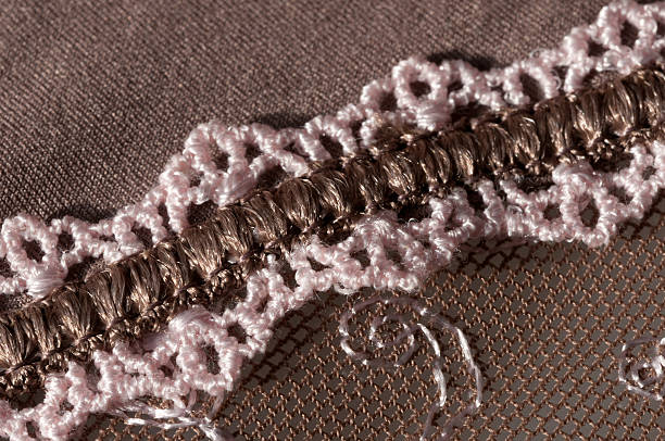 istock diagonal lace, colored rose and cuppery brown 496442825