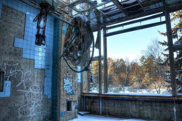 Abandoned operating room in Beelitz Old operating light in a sterile room beelitz stock pictures, royalty-free photos & images