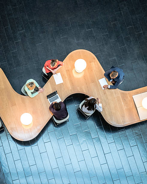 istock Business people meeting in modern office, view from above 496443310