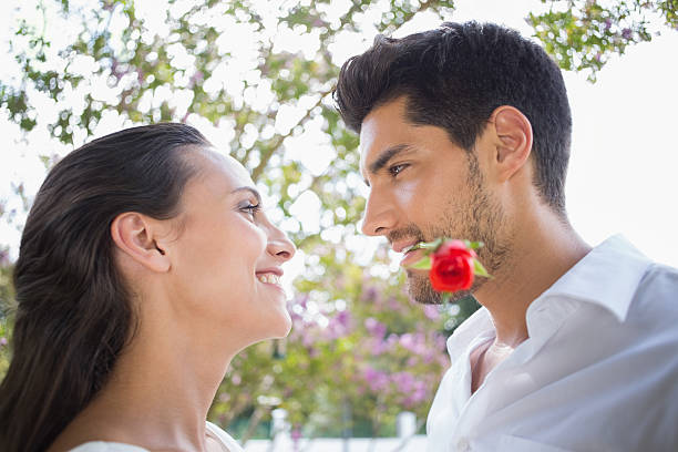 istock Stylish couple with red rose are romantic 496443451