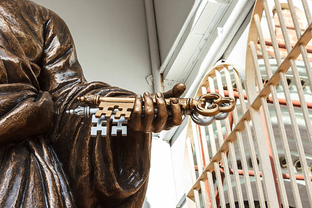 The keys of heaven in Saint Peter hand. Statue of Saint Pete in front of Assumption Cathedral, Bangkok Thailand.