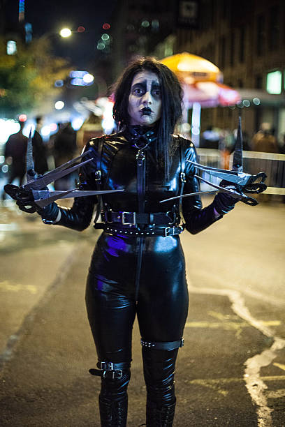 New York City, NY, USA - October 31, 2015: Woman dressed up as Edward Scissorhands for Halloween. Downtown, NYC.