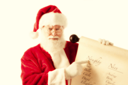 Subject: A Christmas Santa Claus dressed in traditional Santa suit, holding up the Christmas name list with the naughty and the nice.