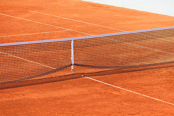 istock Empty Clay Tennis Court and Net 496447675