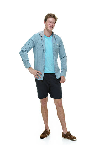 istock Cheerful man standing with hand on hip 496448373