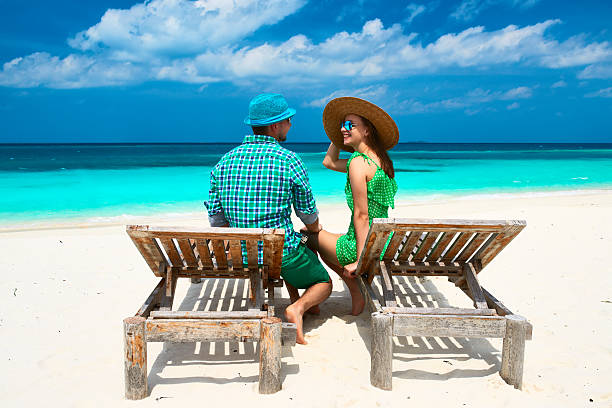 istock Couple in green on a beach at Maldives 496448467