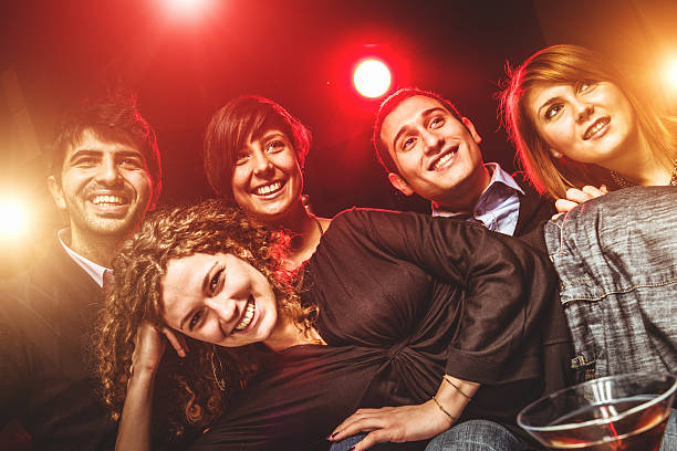 istock People happiness at the disco club toasting 496448537