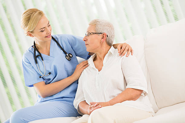 istock Female doctor and senior patient 496448641