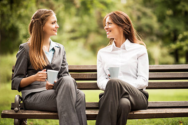 istock Business women talking in the park. 496448867