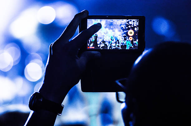 istock concert mobile bokeh blue unrecognizable people human live video photo 496448965