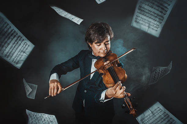 istock Musician plays the violin and sheets with notes  flying around 496474207