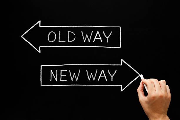 Old Way or New Way Hand drawing Old Way or New Way concept with white chalk on blackboard. crossroads sign stock pictures, royalty-free photos & images