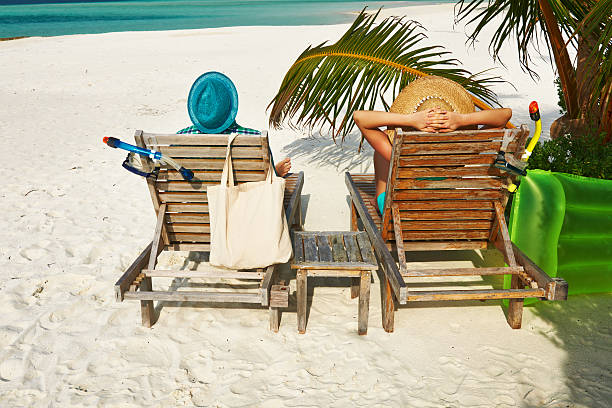 istock Couple in green on a beach at Maldives 496475267