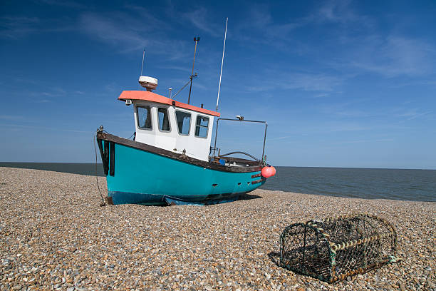 istock fishing boat on an English beach 496475517