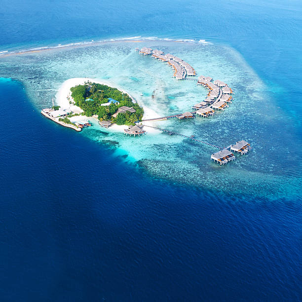 istock Atolls and islands in Maldives from aerial view 496477263