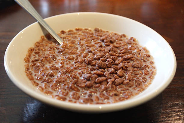 istock Cocoa rice krispies breakfast cereal in white bowl with milk 496478081