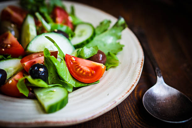 istock Vegetable salad on wooden background 496478303