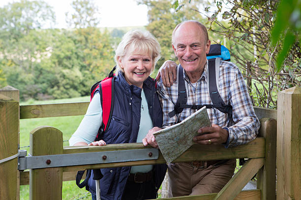 istock Active Senior Couple On Walk In Countryside 496479144