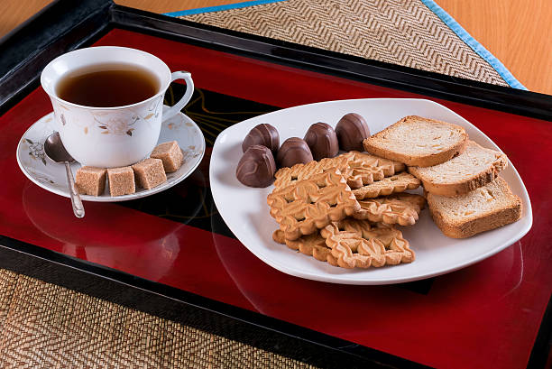 istock tea cookies, crackers and candies on a tray 496480138