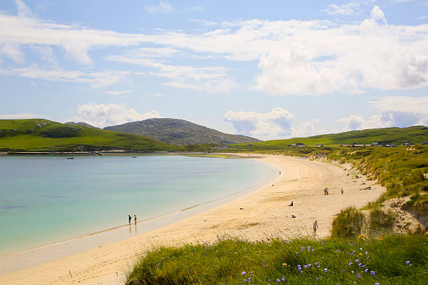 People Enjoying Vatersay Beach, Vatersay, Scotland stock photo