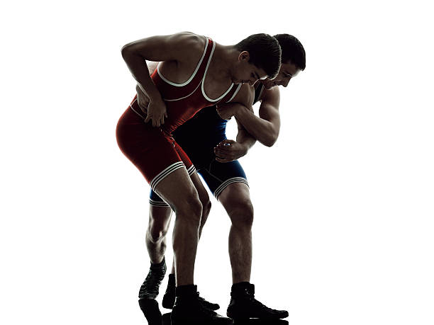 istock wrestlers wrestling men isolated silhouette 496481194