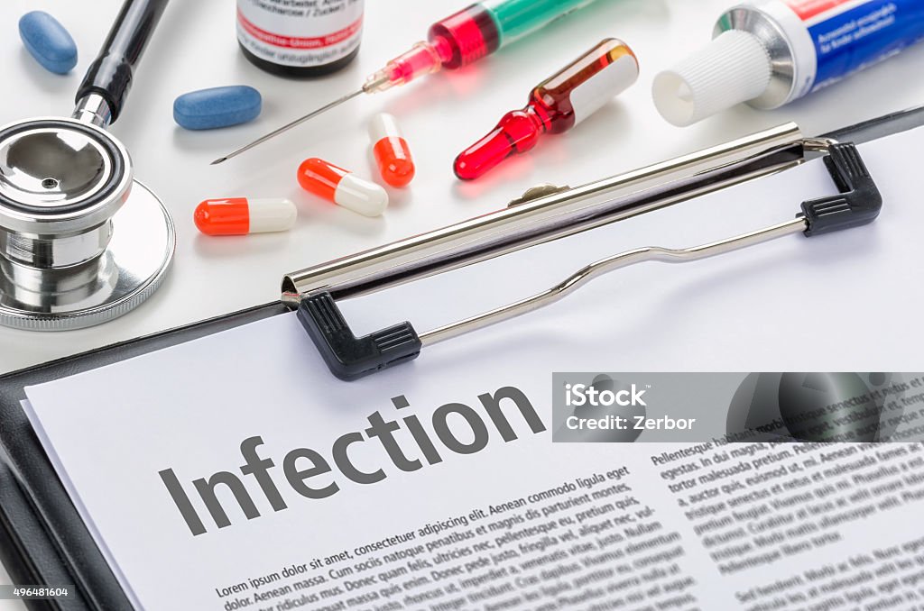 The diagnosis Infection written on a clipboard 2015 Stock Photo