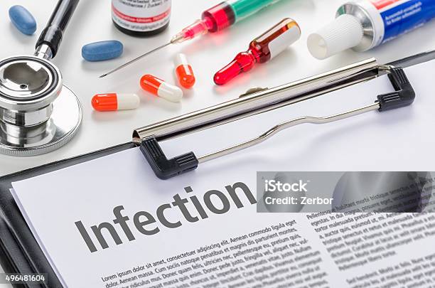 The Diagnosis Infection Written On A Clipboard Stock Photo - Download Image Now - 2015, Bacterium, Bottle