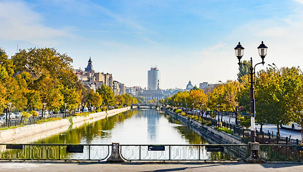 River Dambovita in Bucharest, Romania River Dambovita in Bucharest, Romania with the city skyline and colorful trees in foliage bucharest stock pictures, royalty-free photos & images